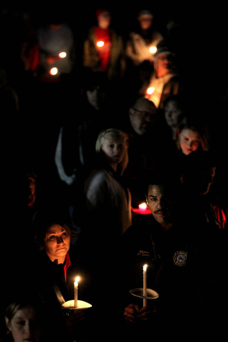 General News - 2nd placeUncertainty, fear and sadness fill the faces of the people of Chardon as they hold candles while mourning the loss of three high school students shot at Chardon High School during a vigil outside of St. Mary's Church across the street from Chardon High School. Three boys have died since Monday morning's shooting. Thousands of people filled the grounds of St. Mary's after the inside was full.  (Lisa DeJong / The Plain Dealer)