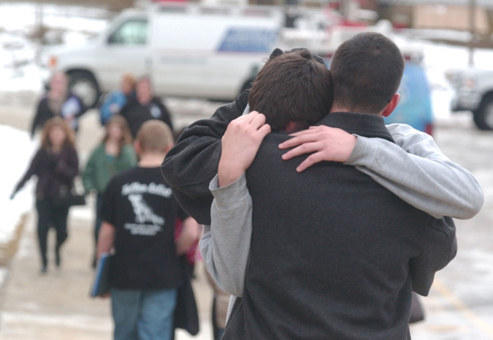 Spot News - 2nd placeParents from the Chardon school system pick up their children after a shooting at Conneaut High School that left one person dead and four injured Monday morning. (Warren Dillaway / Ashtabula Star Beacon)
