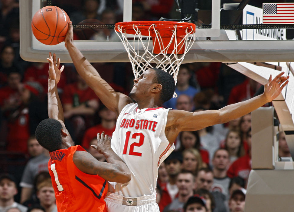 Sports - 1st placeOhio State forward Sam Thompson (12) blocks a shot of Illinois guard D.J. Richardson (1) in the 2nd half of their NCAA College Basketball game at Value City Arena in Columbus.   (Kyle Robertson / The Columbus Dispatch)