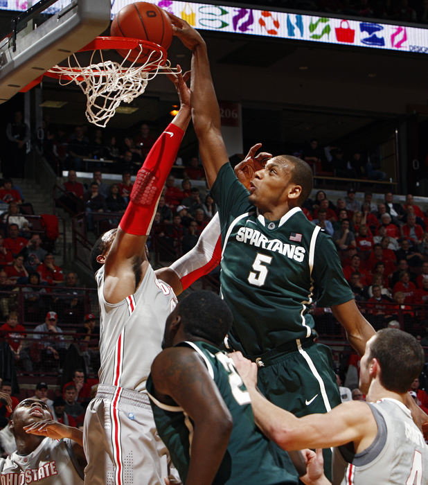 Sports - 2nd placeMichigan State center Adreian Payne (5) dunks over Ohio State forward Jared Sullinger (0) in the 1st half  during their College Basketball game at Value City Arena.  (Kyle Robertson / The Columbus Dispatch)