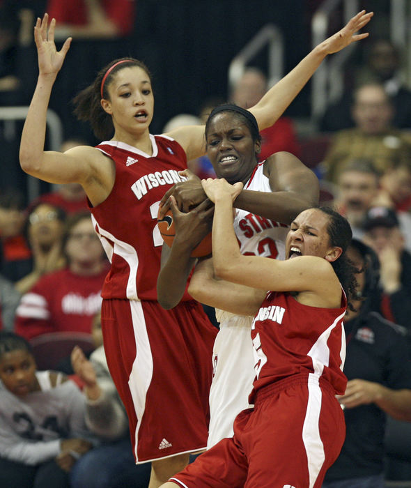Sports - 3rd placeOhio State center Darryce Moore (22) fights with Wisconsin guard Morgan Paige (5) for control of the ball in late first half action at Value City Arena.  (Chris Russell / The Columbus Dispatch)