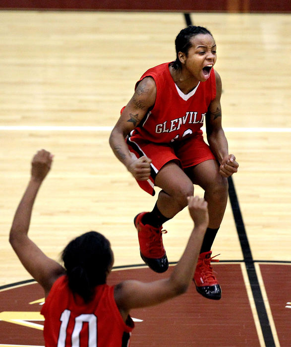 Sports feature - 2nd placeGlenville's Keesha Henderson starts the party after the Tarblooders defeated John Hay for the Senate Athletic League girls basketball crown. (Lisa DeJong / The Plain Dealer)