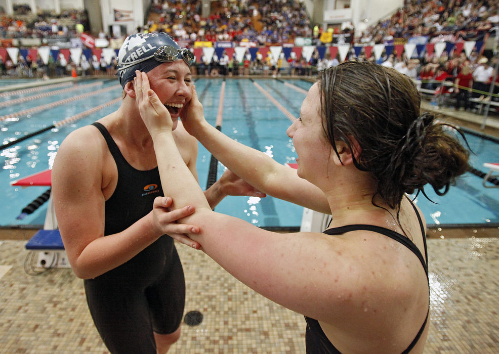 Story - 1st placeBishop Hartley's Andrea Cottrell (left) celebrates with her good friend and Columbus Academy swimmer India Sherman after winning the Women 100 Yard Breaststroke Division II Finals with a time of 1:03.32 at C.T. Branin Natatorium in Canton.  (Kyle Robertson / The Columbus Dispatch)