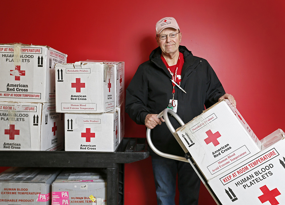 John Montgomery, 71, drives blood donations to hospitals and from donation centers for the Red Cross. Both he and his late wife received blood donations, and he says it's his way of returning the favor.  (Barbara J. Perenic / The Columbus Dispatch)