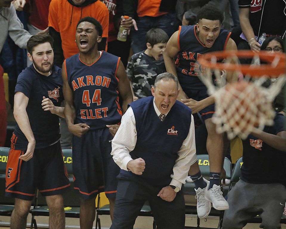 Ellet coach Mark Fisher and the bench erupt after Ellet's Storm Chevy gets an And-1 in the fourth quarter against Buchtel  at Firestone High School in Akron. (Leah Klafczynski/Beacon Journal/Ohio.com) (Leah Klafczynski / Akron Beacon Journal)