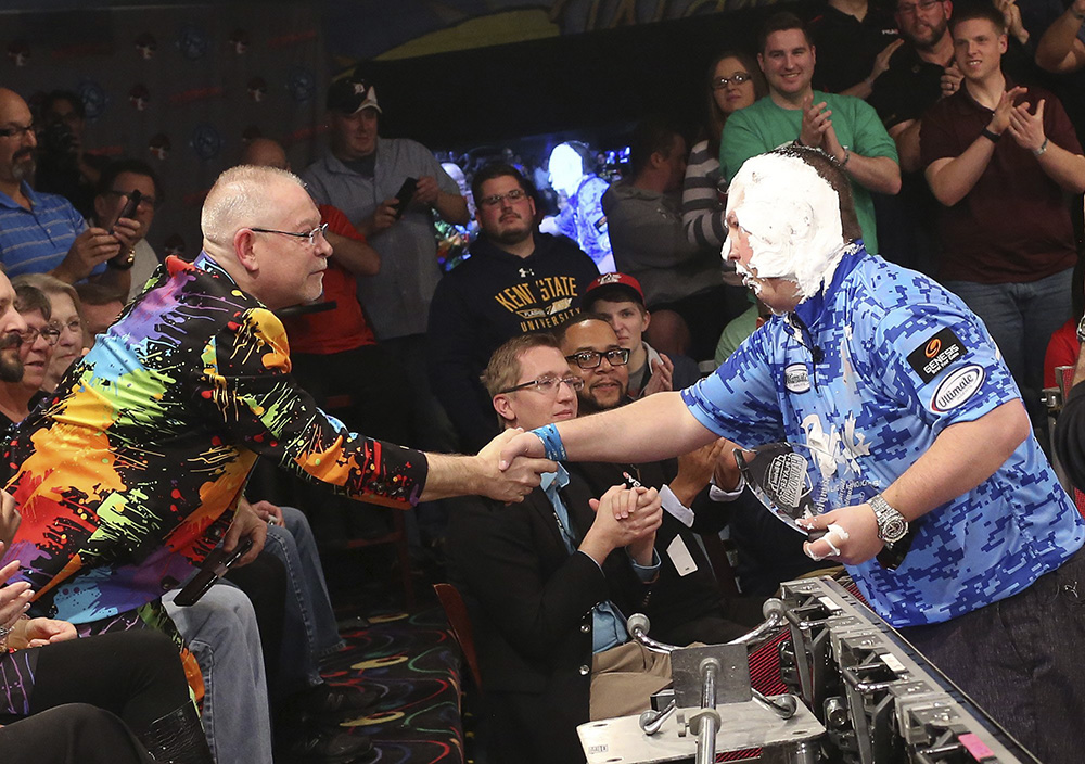 Bowling Alley owner Wayne Webb, L, shakes hands with Tom Smallwood, winner of the 2018 PBA Barbasol Players Championship following the final rounds of the competition at Wayne Webb's Columbus Bowl in Columbus.  (Brooke LaValley / The Columbus Dispatch)