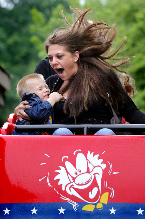 Feature - 2nd placeMyles Wisniewski, 3, of Garfield Heights, grabs onto his mother Sarah Savnik on his very first "Little Dipper" roller coaster ride at Memphis Kiddie Park  and Miniature Golf. The Little Dipper is the oldest operating steel coaster at the same location in North America. The Memphis Kiddie Park opened in 1952 and in it's 61st year.  ( Lisa DeJong / The Plain Dealer)