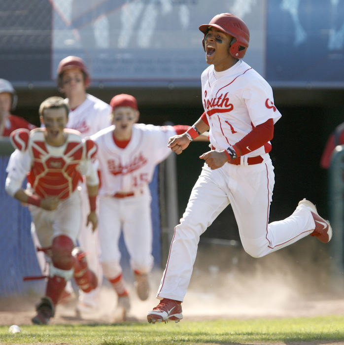 Sports - 1st placeCanton South's Deonte Settles races home to score the winning run in the bottom of the 12th to give the Wildcats a 1-0 victory over Triway in the Div II district semifinal game at Thurman Munson Stadium in Canton. (Scott Heckel / The (Canton) Repository)