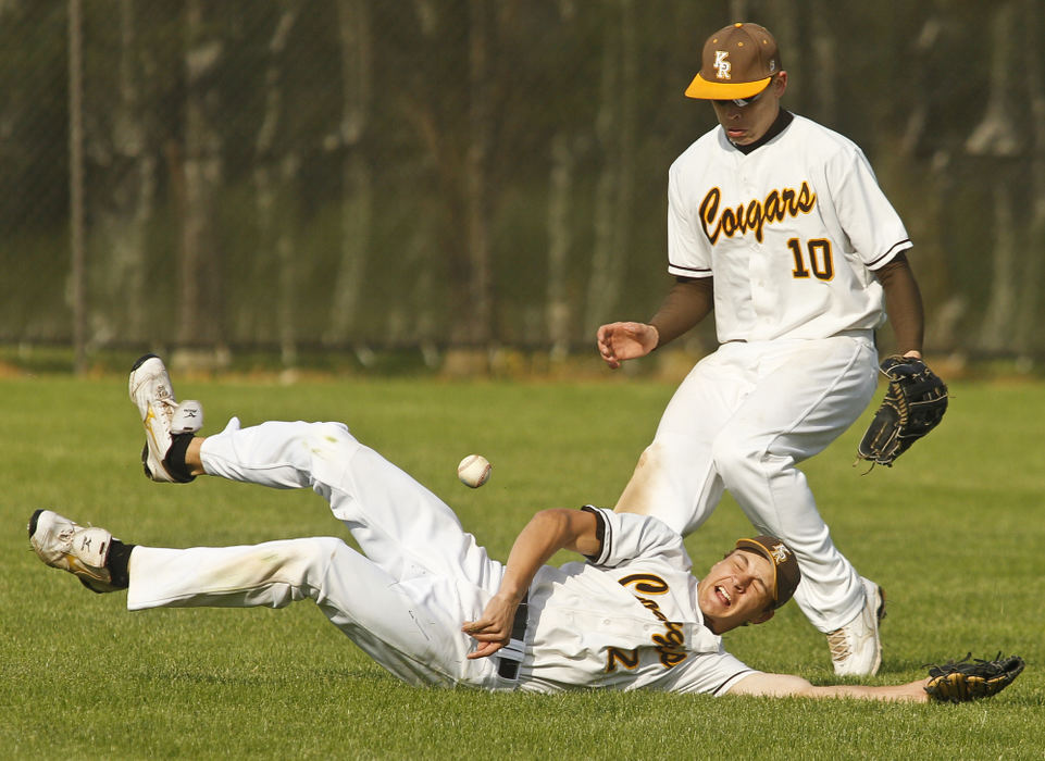 Sports - 3rd placeRobbie Ashbaugh, (2) of Kenton Ridge dives for a fly ball in the outfield backed up by Darrian Hamilton (10) during a Division II sectional baseball game against Graham. Kenton Ridge won the game 3-2. (Barbara J. Perenic / Springfield News-Sun)