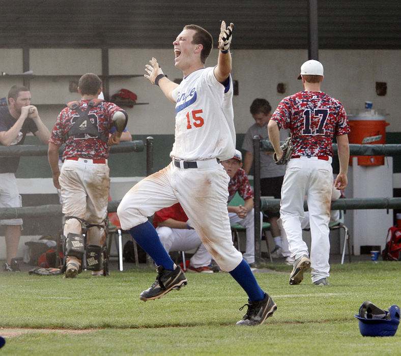 Sports feature - 3rd placeOrange's Brai Beckel celebrates as he heads toward home plate after hitting the game winning home run during their Div. I regional semi-final game at Dublin Coffman High School May 24, 2012. (Chris Parker / ThisWeek Newspapers)