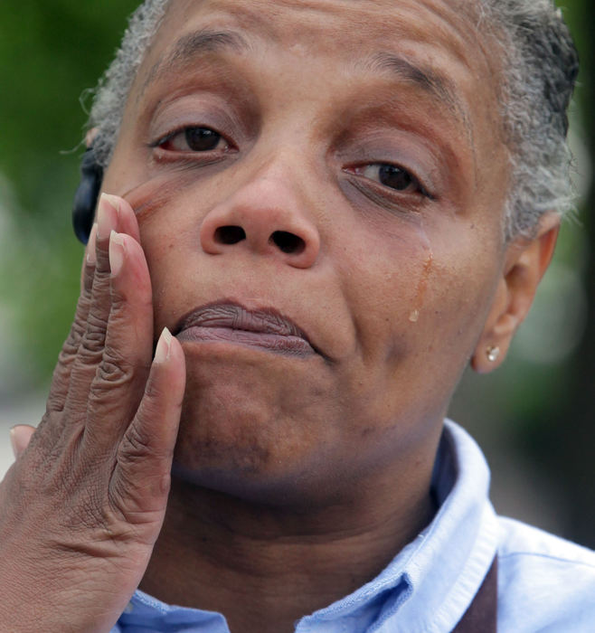 General News - 2nd placeA tearful April Roberts-Gilbert, mother of Ronald Roberts, talks about Akron Police apprehending the man who aledgely murdered Ronald and 3 others on Independence Ave. a month ago.  (Phil Masturzo / Akron Beacon Journal)
