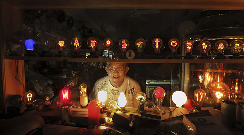 Portrait - 2nd place - Don Gfell, with his light bulb collection. Don runs the Sights and Sounds of Edison shop. (Tom Dodge / The Columbus Dispatch)