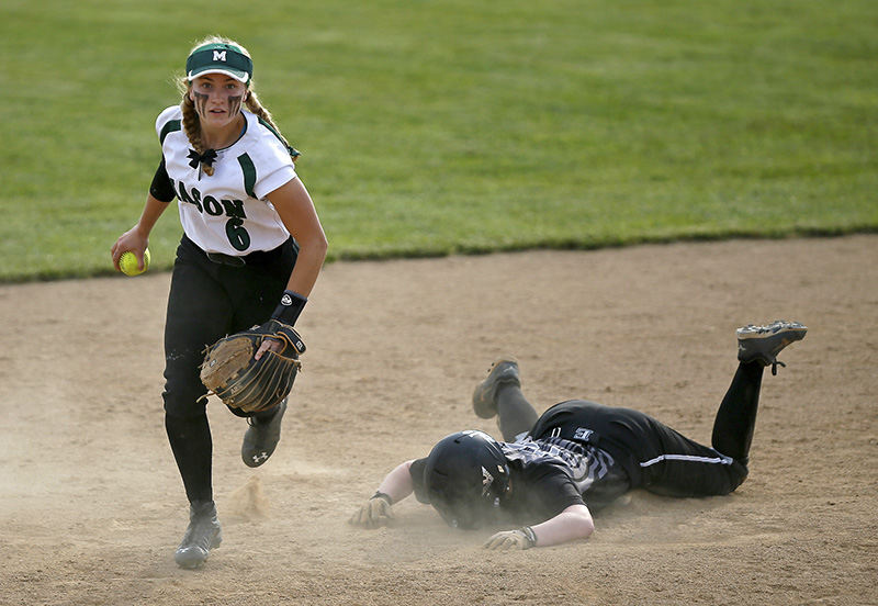 SSports - 2nd place - Lakota junior Melissa Jacobson (10) remains on the ground after being put out at second base by Mason second baseman Olivia Hopkins (6) during the bottom of the seventh inning of their Div I district championship game at Northmont High School in Clayton.  (Sam Greene / Cincinnati Enquirer)