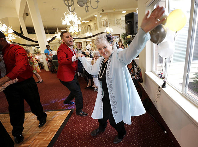Feature - 2nd place - Resident Bonnie Wilson, 68, dances with activities coordinator Brant Baker at the Amber Park Assisted Living Community during their 2nd annual Prom with the theme of Putting on the Ritz. (Jonathan Quilter / The Columbus Dispatch)