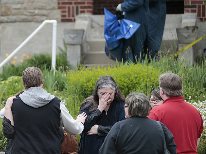 ASpot News - 3rd place - Family and neighbors wait on the sidewalk as authorities investigate a home where a deaf couple was found dead after they inadvertently left their car running in their garage  in Madisonville.  (Kareem Elgazzar / The Cincinnati Enquirer)