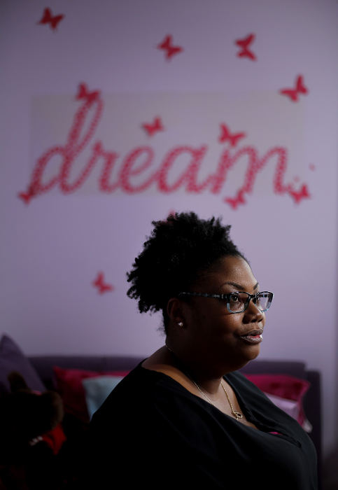 Portrait - 2nd place - Jotrell Henry, 38, of Canal Winchester sits in the room where her 11-year-old daughter, Shakyla, used to live before passing away on Feb 1, 2016 in Canal Winchester.  Charles Lipscomb went to prison for seven years after shaking his 2-year-old daughter so severely it left her in a wheelchair and with major injuries. The injuries were so severe that, after Lipscomb served his seven-year-prison sentence and was released, Shakyla died nine years later. Because of a decision by a Coroner, the child's death was ruled natural -- despite comments from hospital workers who insisted it was a "homicide" -- and no autopsy was done. After a panel reviewed the child's death, the case was reopened and the Coroner's Office ruled the case a homicide and a supplemental death certificate was issued. But Lipscomb should be facing homicide charges and a potential sentence of life in prison. The Coroner's office didn't tell police or prosecutors, who could take the case to the grand jury, that the child died.  (Kyle Robertson / The Columbus Dispatch)