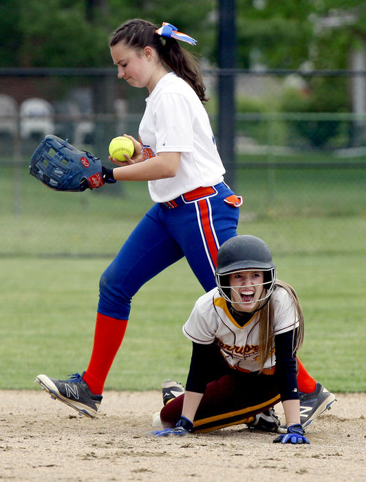 SPSports Feature - 3rd place - Westerville North's Vicki Brumfield reacts as Olentangy Orange's Grace Holz steps over her after sliding safely under the tag at second base during a game at Westerville North High School. (Shane Flanigan / ThisWeek Newspapers)