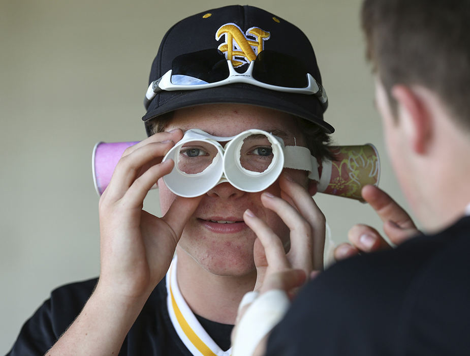    Sports Feature - HM - Sylvania Northview sub Joel Winner puts on the "rally cups" against Anthony Wayne during a Division I district baseball semifinal at Carter Park in Bowling Green. Northview fell to Anthony Wayne 12-6. (Jeremy Wadsworth / The (Toledo) Blade)