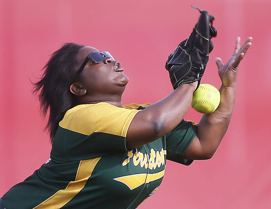 Sports - 1st place - Firestone's Jasmine Griffin misses a catch in the outfield against Ellet during the third inning of the City Series Softball Championship at Firestone Stadium in Akron. (Leah Klafczynski / Akron Beacon Journal)