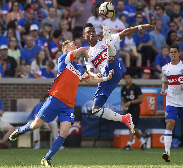 Sports - 2nd place - Toronto FC II's Louis Pereira stretches for a kick over FC Cincy defender Matt Bahner during the first half of action  at Nippert Stadium. FC Cincinnati defeated Toronto 1-0  (Erik Schelkun / Elsestar Images)