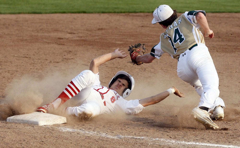 SPSports - 3rd place - Marysville's Kaleb Schultz avoids the tag from Dublin Jerome's Nick Lapham during a tournament game at Marysville High School. (Shane Flanigan / ThisWeek Newspapers)