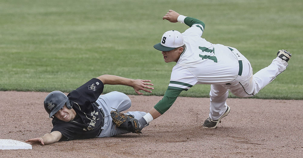    Sports - HM - Perrysburg's Jake Krueger (left) steals second base as Strongsville second baseman Trevor Denning covers the play during a Division I regional semifinal game at Steller Field in Bowling Green. Strongsville defeated Perrysburg 3-2. (Jeremy Wadsworth / The (Toledo) Blade)