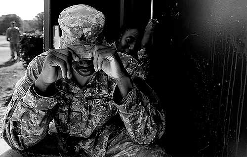 First place, Larry Fullerton Photojournalism Scholarship - Hannah Potes / Kent State UniversitySergeant Keith Mack, 31, rests outside before the deployment ceremony for the 1461st Transportation Company at Parkside Middle School. This will be Sergeant Mack's second tour overseas.