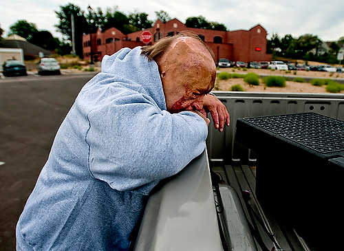 First place, Larry Fullerton Photojournalism Scholarship - Hannah Potes / Kent State UniversityKlavon rests against the side of his daughter Erin Klavon's truck after a long day at Great Lakes Burn Camp. It had been five years since Klavon, it's founder, had stepped foot on the grounds of the camp. "I think it bothers Dad that he's not so involved anymore," Erin said. "But he loves the place anyway. I think he's just happy he can help kids like him."