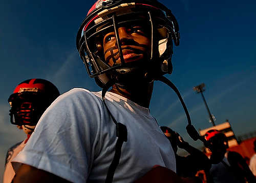 First place, Larry Fullerton Photojournalism Scholarship - Hannah Potes / Kent State UniversityJackson High School sophomore Javon Greca, 15, waits on the sidelines during a 7x7 passing scrimmage at Dungy Field in Jackson, MI.