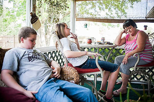 Second place, Larry Fullerton Photojournalism Scholarship - Steven Turville / Ohio UniversityWife of retiree Mike Gorrell, Karen, sits on her back porch alongside her grandchildren in Mineral Wells, West Virginia, on April 30, 2012. Gorrell has taken on a position of leadership among the retirees. "My dad used to say, you gotta stand for something or you’ll fall for anything. And this is just something I decided I had to stand for."