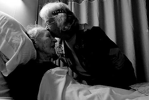 First place, Larry Fullerton Photojournalism Scholarship - Hannah Potes / Kent State UniversityOllie Deaton-Turner, 77, kisses the forehead of her former sweetheart Roscoe Terry, 88, at Nim Henson Geriatric Center in Jackson, Ky. Turner visits Terry at least once a week to bring him hot meals and the latest news.