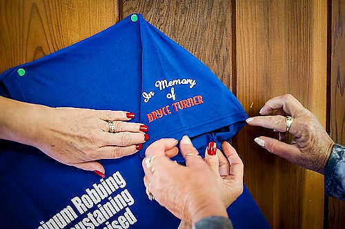 Second place, Larry Fullerton Photojournalism Scholarship - Steven Turville / Ohio UniversityKaren Gorrell and Sonia Lovejoy pin a teeshirt used by the retirees during public events and appearances on a wall inside the Ravenswood United Steelworkers Union, where the retirees hold regular meetings. The retirees have already lost members of their cause since starting the movement. "There’s not anybody feeling like we wanna jump up and down and celebrate because it’s just not done yet," Gorrell said. "You know, there’s always doubts, we always have skepticism, and we just wanna see it done."