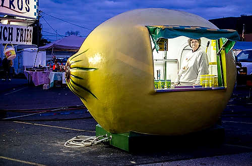 Second place, Larry Fullerton Photojournalism Scholarship - Steven Turville / Ohio UniversityEmma Call of Ironton, Ohio, stands inside the lemon shake up stand she runs alongside her husband, Benny, at the Circleville Pumpkin Show in Circleville, Ohio, on October 21, 2011. The couple does business at various public events across the region.