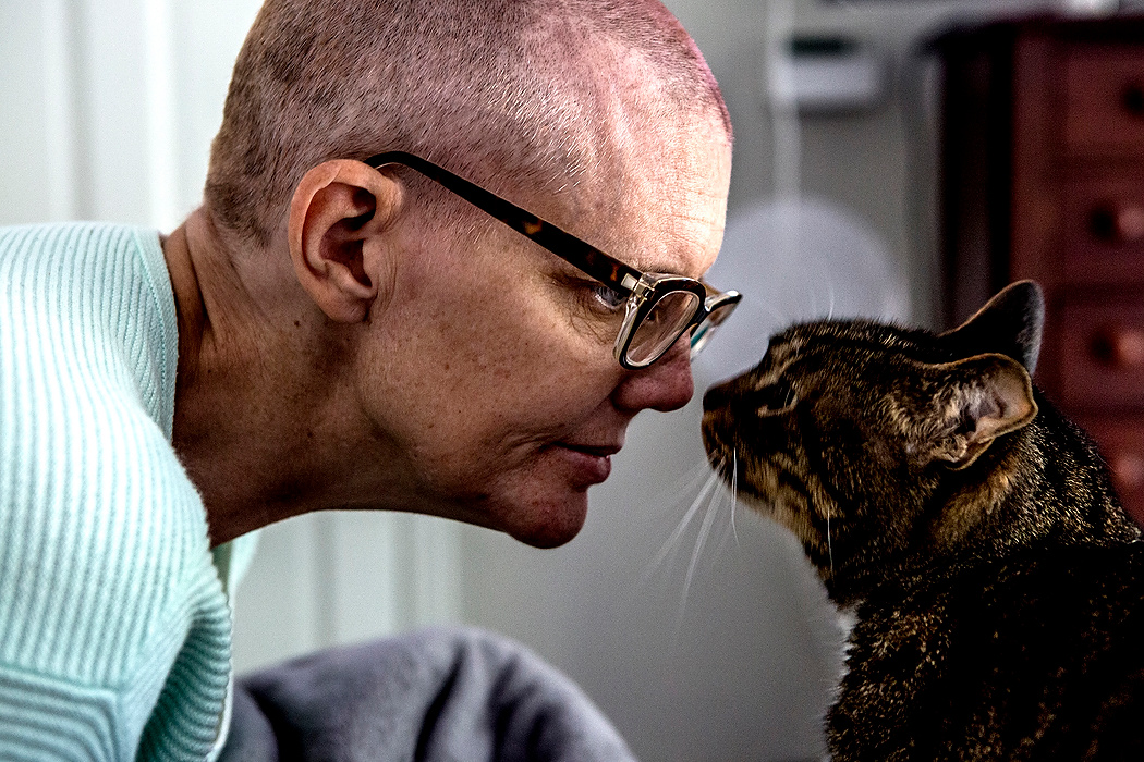 First place, Feature Picture Story - Jessica Phelps / Newark AdvocateStacey Heath spends time with her cat, Bob. When clumps of hair began to fall out, Stacey called on her friend to help her cut off her hair. It was 14 days after her first chemotherapy treatment and right on schedule with what her doctors had told her. 