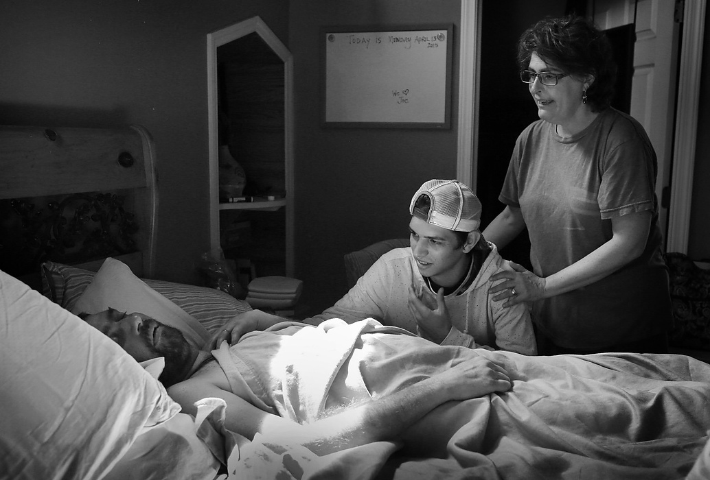 Second place, Feature Picture Story - Carrie Cochran / Cincinnati EnquirerApril 13, 2015: Alex Neyer, Joe's oldest son, sees his father for the first time since Joe was put on continuous Hospice care. Alex had just moved to Florida, where he was staying with his grandparents – Becky's mom and dad. "Obviously when he dies is gonna be a very emotional time for everybody. All of his wisdom leading up to it, I don't think it's for that stretch of time. I think it's for after that, the years after." 