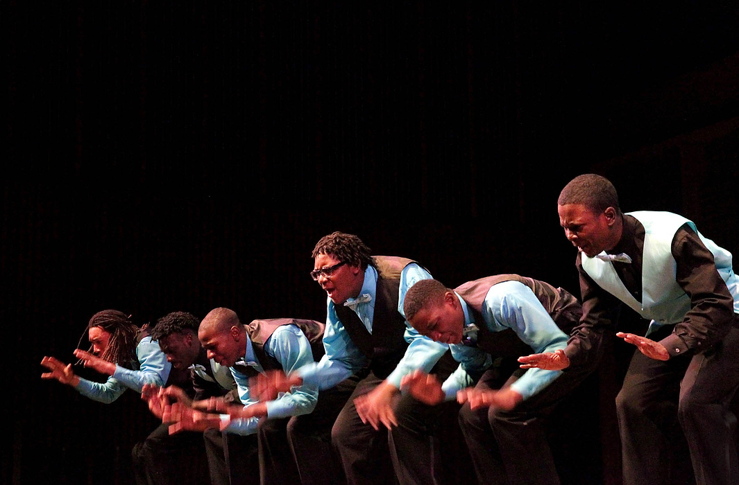 First place, James R. Gordon Ohio Undertanding Award, "Distinguished Gentlemen of Spoken Word" - Lynn Ischay  / The Plain DealerThese young poets regularly win the hearts of their audiences, routinely bringing them to tears. Everette Mitchell, III, center, second mic with the Distinguished Gentlemen, performs at the Cleveland Museum of Art, backed up by his DGSW brothers.  
