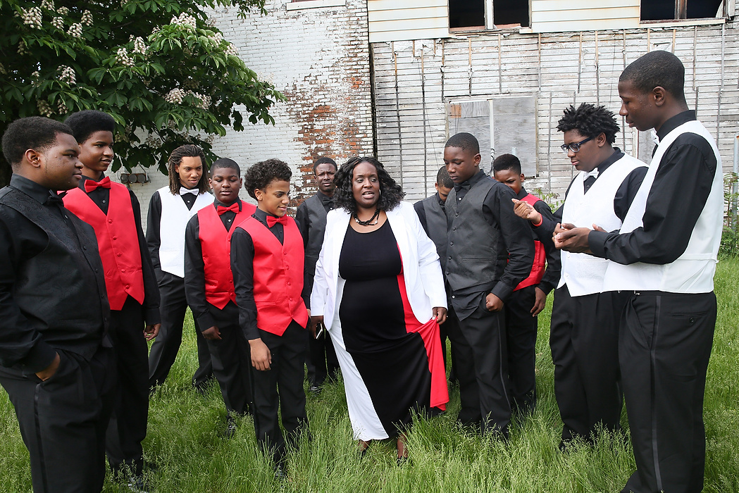 First place, James R. Gordon Ohio Undertanding Award, "Distinguished Gentlemen of Spoken Word" - Lynn Ischay / The Plain DealerHoney Bell-Bey and the Distinguished Gentlemen of Spoken Word do some last minute rehearsing in their neighborhood before performing at a church. The gentlemen respect Bell Bey and give her undivided attention.