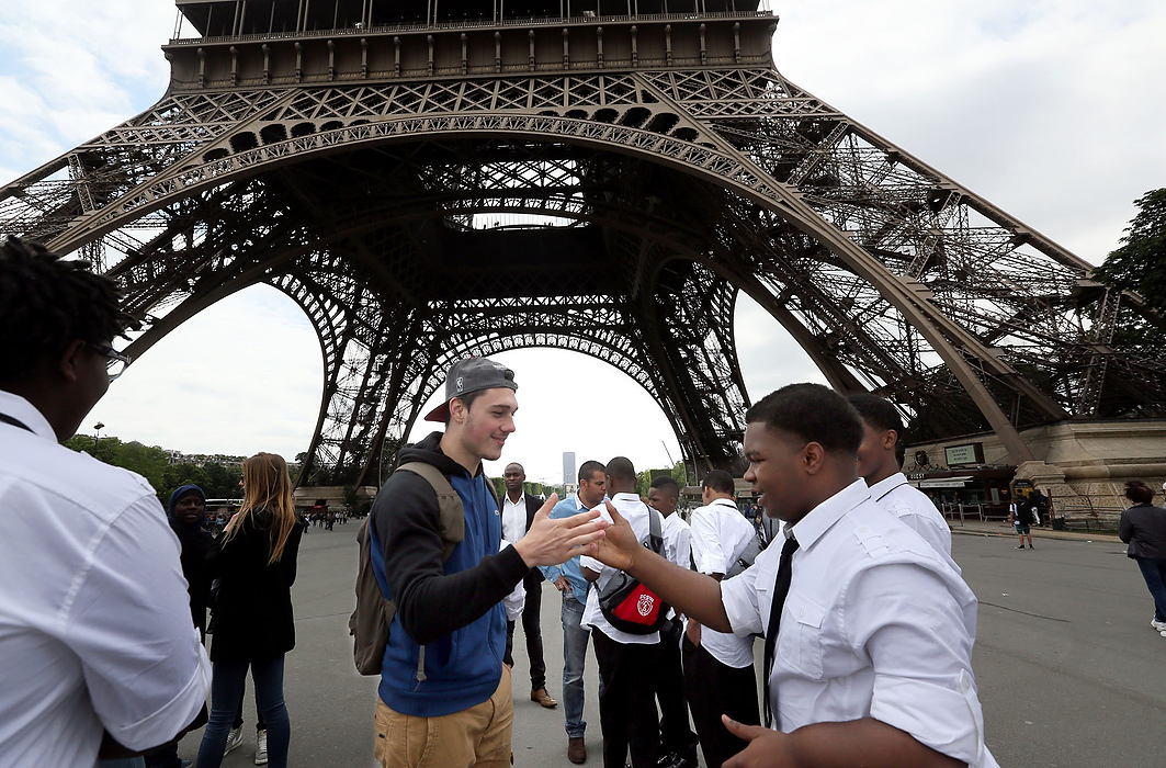 First place, James R. Gordon Ohio Undertanding Award, "Distinguished Gentlemen of Spoken Word" - Lynn Ischay / The Plain DealerAndreja Miloradovic greets Antoine Morris with the hand shake they practiced yesterday at Lysee Alfred Nobel in Clichy-sous-Bois. The French students surprised the gents by  meeting them at the Eiffel Tower. 