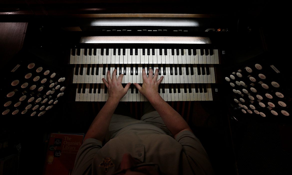 Second Place, Photographer of the Year - Large Market - Adam Cairns / The Columbus DispatchOrganist Christopher Warner plays the renovated organ inside Livingston United Methodist Church in Columbus on Nov. 4, 2015. The church spent $50,000 to revitalize the instrument that is a hybrid of several different organs, including an 1894 Felgemaker, 1939 Schantz and 1984 Bunn = Minnick. 