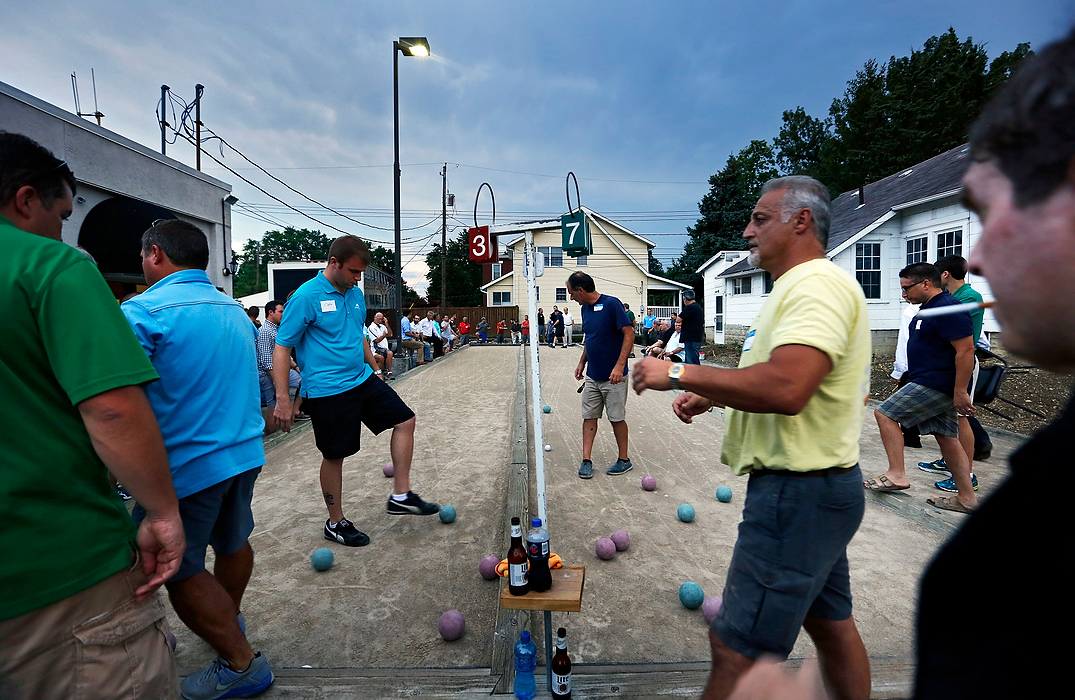 Second Place, Photographer of the Year - Large Market - Adam Cairns / The Columbus DispatchPlayers clear the balls from the court between turns during the playoffs for the Columbus Italian Club's annual bocce tournament at their headquarters in Grandview Heights on Aug. 19, 2015. The annual tournament has been conducted since the courts were built 26 years ago. Bocce was an ancient Roman sport that dates back to pre-B.C. era and is still popular within the Italian culture. 