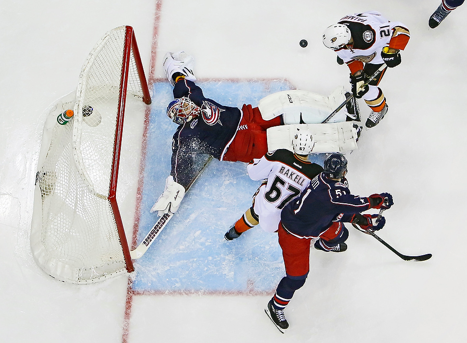 Second Place, Photographer of the Year - Large Market - Adam Cairns / The Columbus DispatchColumbus Blue Jackets goalie Sergei Bobrovsky (72) blocks a shot by Anaheim Ducks right wing Kyle Palmieri (21) in front of center Rickard Rakell (67) and defenseman Fedor Tyutin (51) during the first period of the NHL game at Nationwide Arena on March 24, 2015.