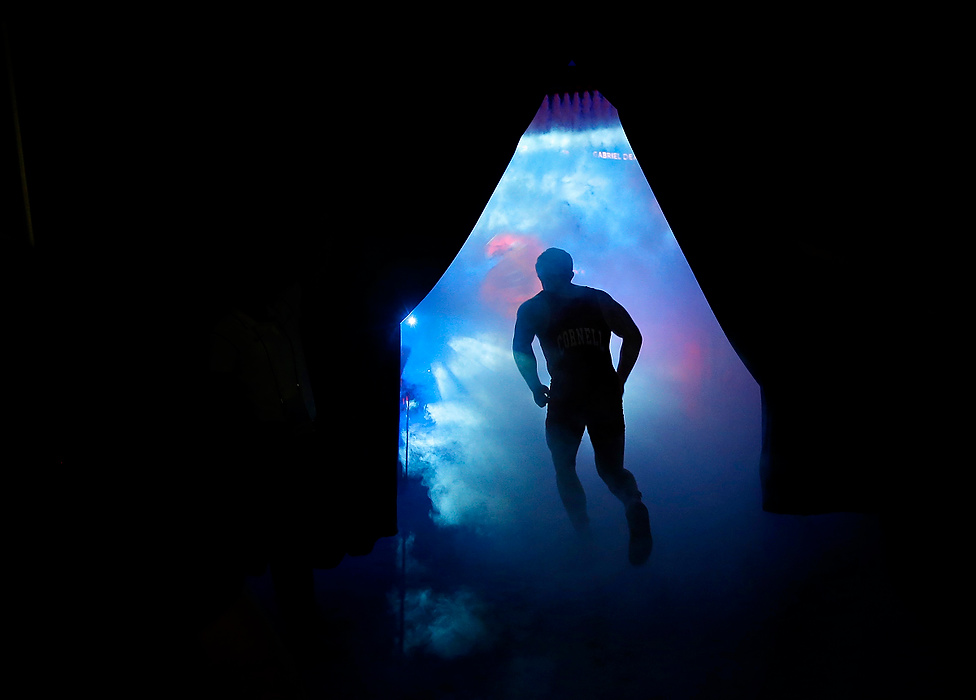 Second Place, Photographer of the Year - Large Market - Adam Cairns / The Columbus DispatchCornell wrestler Chris Villalonga enters the arena during the final round of the NCAA Div. I wrestling championship at the Scottrade Center in St. Louis on March 21, 2015.