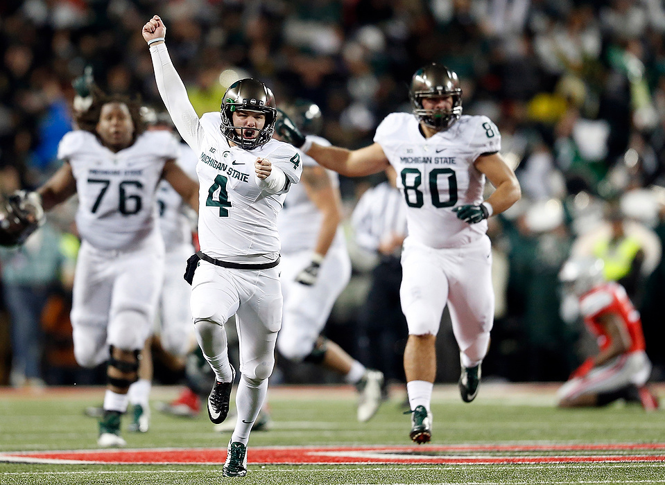Second Place, Photographer of the Year - Large Market - Adam Cairns / The Columbus DispatchMichigan State Spartans place kicker Michael Geiger (4) celebrates making a 41-yard field goal as time expired during the fourth quarter of the NCAA football game at Ohio Stadium in Columbus on Nov. 21, 2015. Michigan State won 17-14.