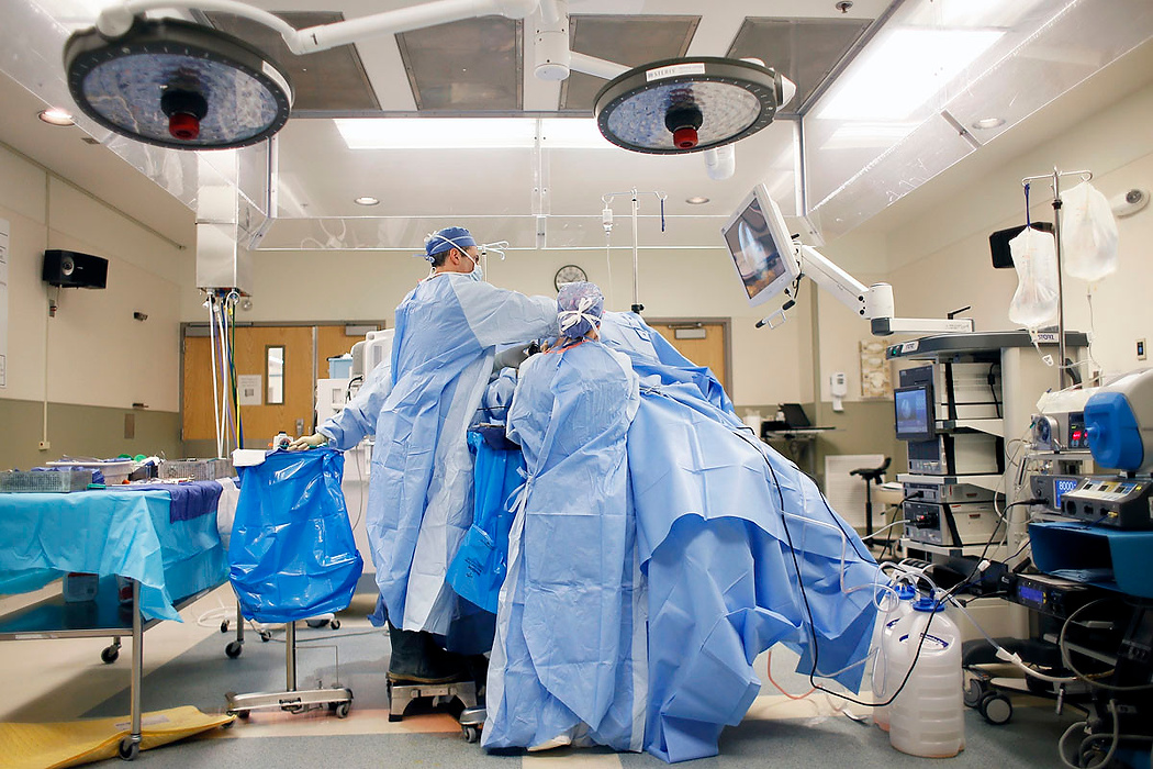 Second Place, Photographer of the Year - Large Market - Adam Cairns / The Columbus DispatchOrthopedic surgeon Brian Cohen performs a reconstructive shoulder surgery on Linda Hall at Adena Health System in Chillicothe on June 10, 2015.