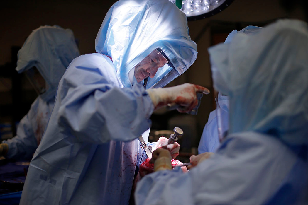 Second Place, Photographer of the Year - Large Market - Adam Cairns / The Columbus DispatchOrthopedic surgeon Brian Cohen performs a total knee replacement at Adena Health System in Chillicothe on June 10, 2015. Surgery can be a very physical task, so Dr. Cohen wakes up at 3 a.m. every day to work out before making the hour commute to work. 