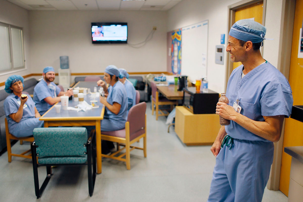 Second Place, Photographer of the Year - Large Market - Adam Cairns / The Columbus DispatchWhile drinking one of his five daily protein shakes, orthopedic surgeon Brian Cohen jokes around with his team of surgical technicians in the staff lounge at Adena Health System in Chillicothe on June 10, 2015.