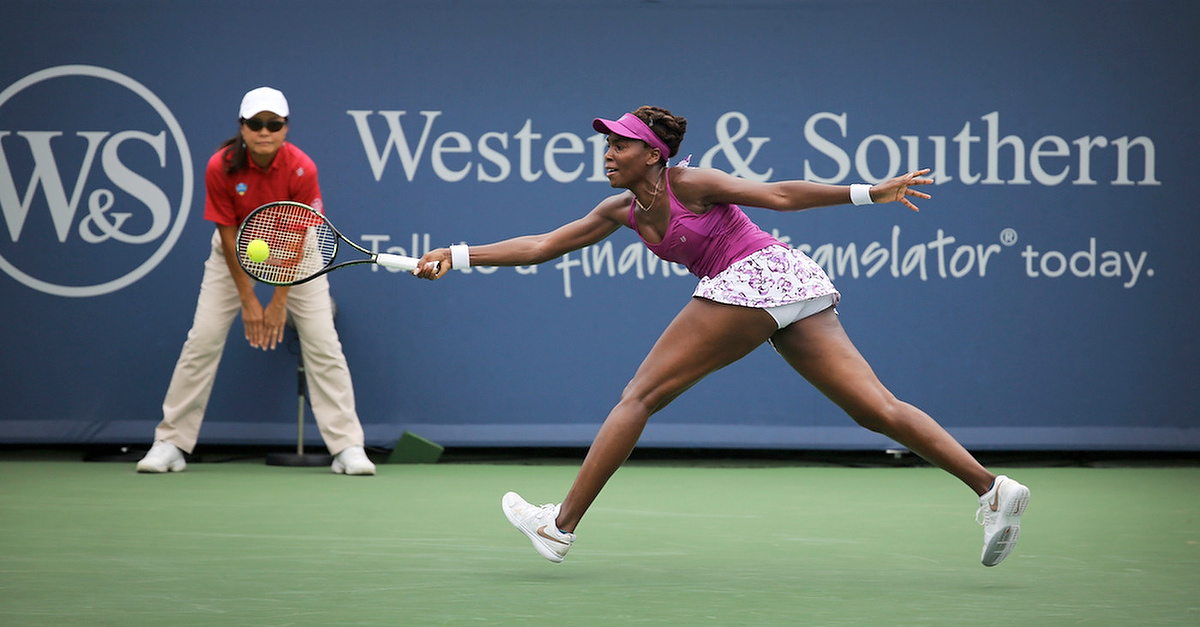 First Place, Photographer of the Year - Large Market - Carrie Cochran / Cincinnati EnquirerVenus Williams plays Zarina Diyas in Monday's match at the Western & Southern Open in Mason, Ohio. Williams won 7-6(6), 6-4.