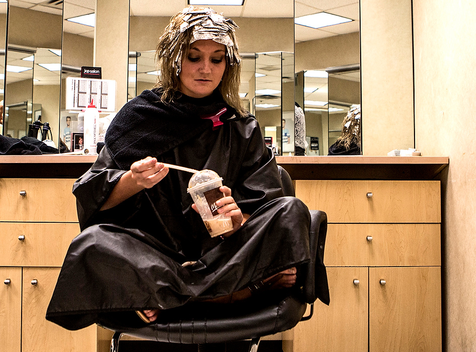 First Place, Photographer of the Year - Small Market - Jessica Phelps / Newark AdvocateKatie Hitchens finishes an iced latte while sitting in the salon at JC Penny's. Katie had to get the color in her hair fixed before the Miss Ohio Outstanding Teen pageant the following week. 