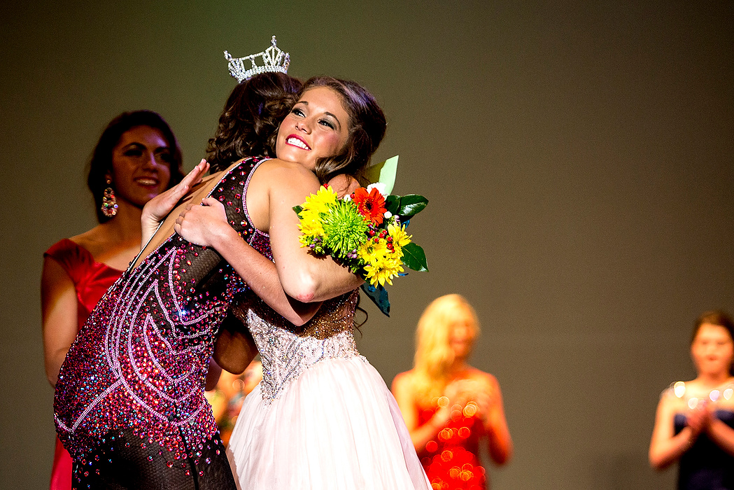 First Place, Photographer of the Year - Small Market - Jessica Phelps / Newark AdvocateAbbey Hitchens is hugged by Rosie Westerbeck, the 2014 Miss Ohio Outstanding Teen as she accepts her her flowers as second runner up in the pageant.  