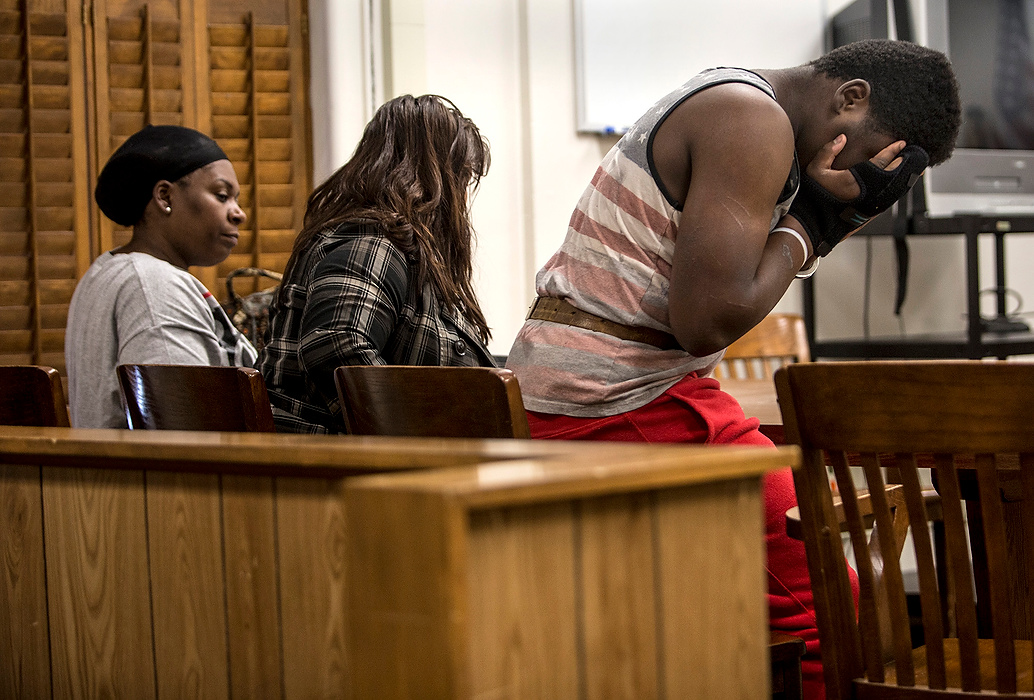First Place, Photographer of the Year - Small Market - Jessica Phelps / Newark AdvocateProphet Johnson, right, exits a Licking County Juvenile courtroom Friday afternoon. Johnson was ordered to be held in the Multi-County Juvenile Detention Facility in Lancaster.